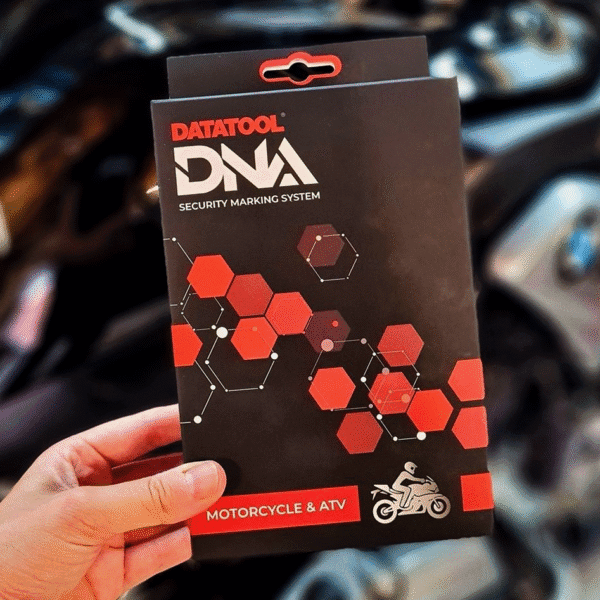 The Datatool DNA box being held in front of a BMW Motorcycle