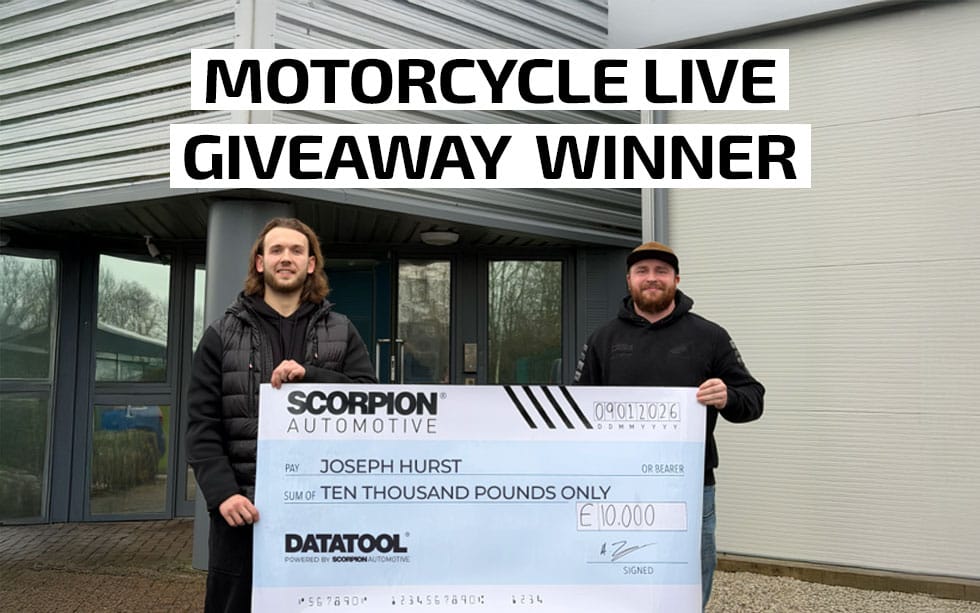 motorcycle live giveaway winner with £10,000 cheque towards their new bike with scorpion automotive ceo